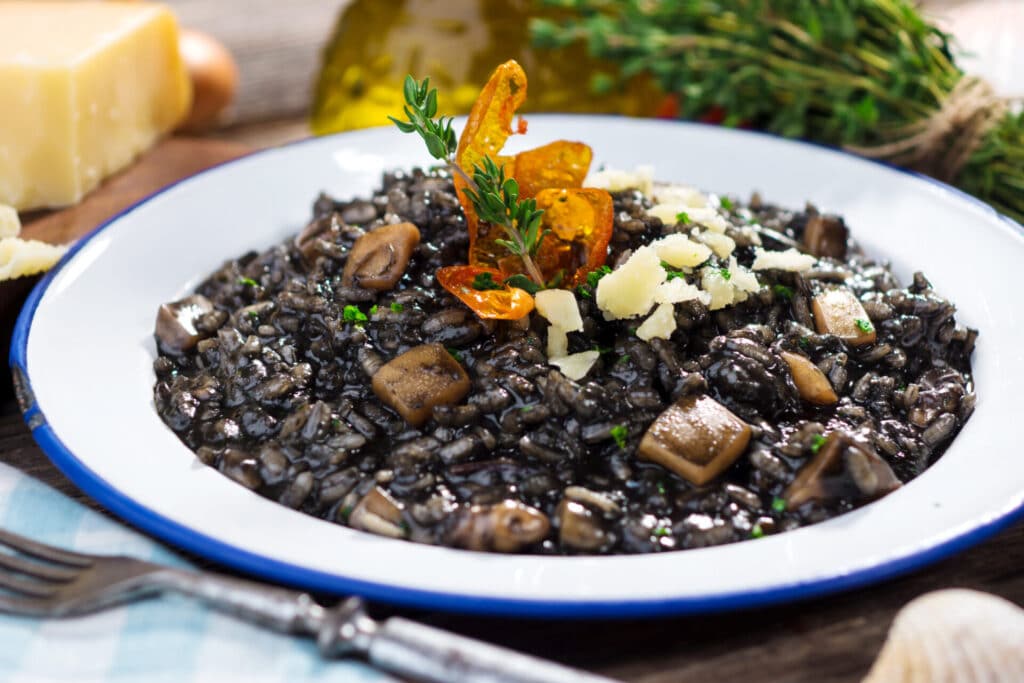 Black risotto with cuttlefish, with sprinklings of parmesan on top
