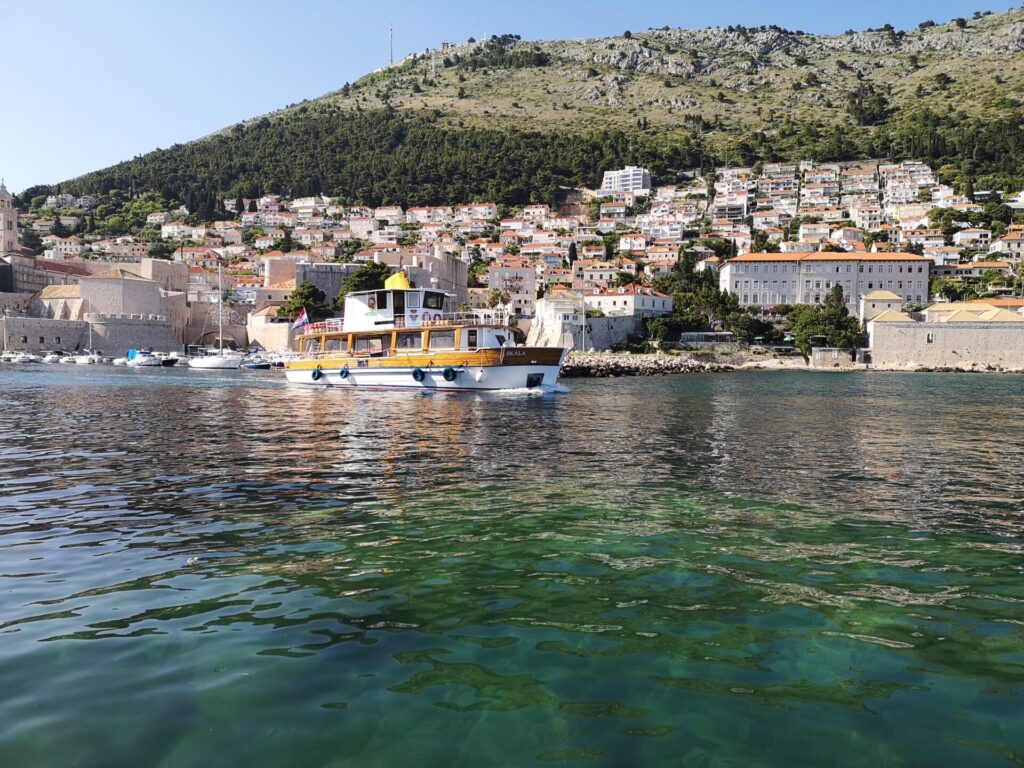A boat leaving the port area of Dubrovnik, Croatia - Dubrovnik travel guide