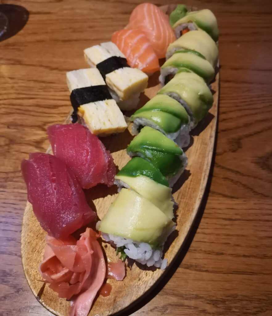 Beautifully prepared mixed sushi on a wooden board at The Sushi Bar in Sofia, Bulgaria