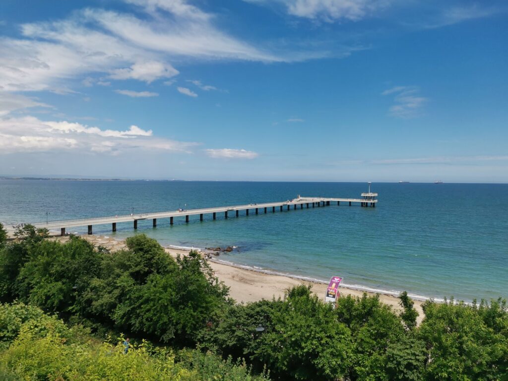 The pier on Burgas sea front and sea gardens behind in Burgas - Burgas travel guide