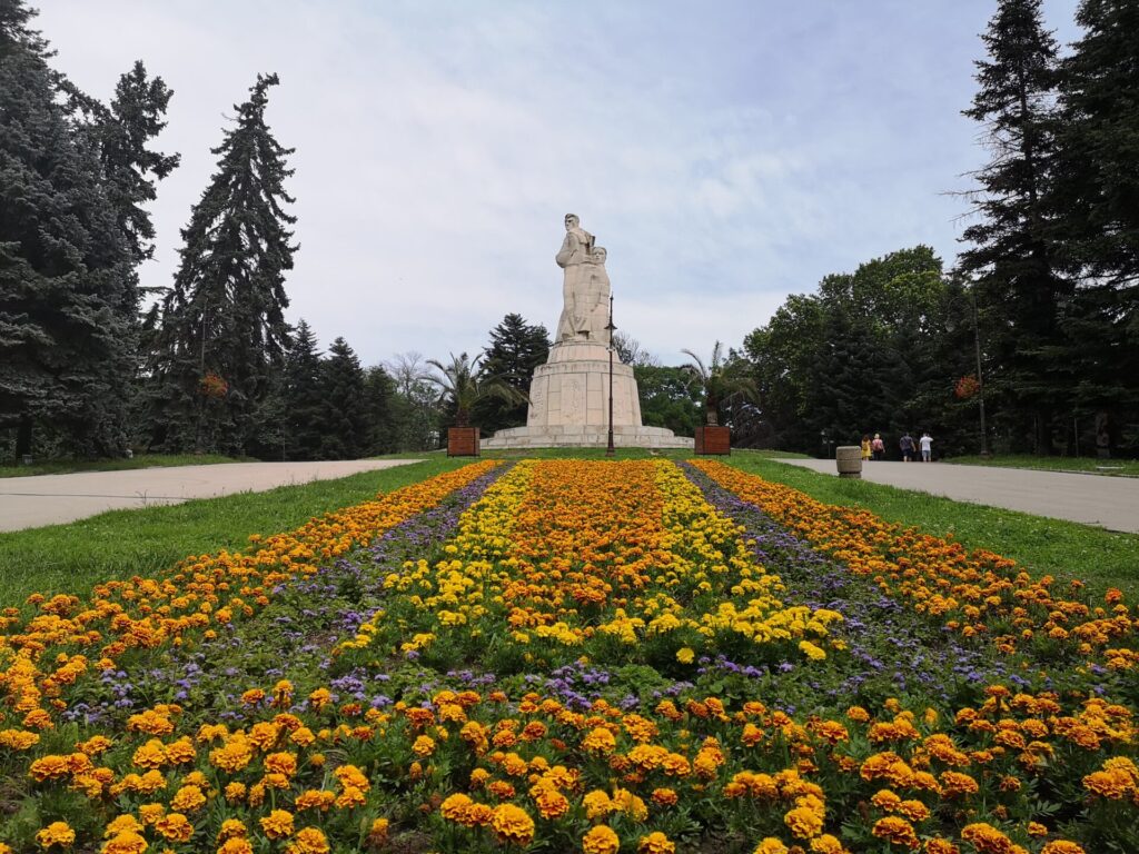 Colourful flowers and monument in Varna Sea Gardens, one of the top things to do in our Varna travel guide