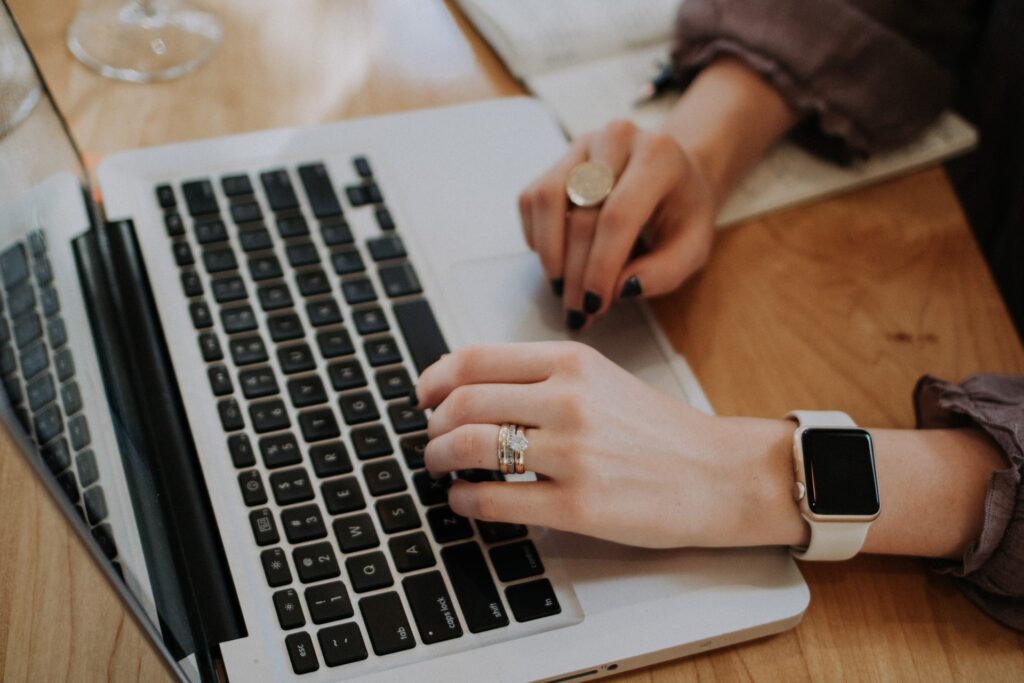 Close up of a woman using a laptop