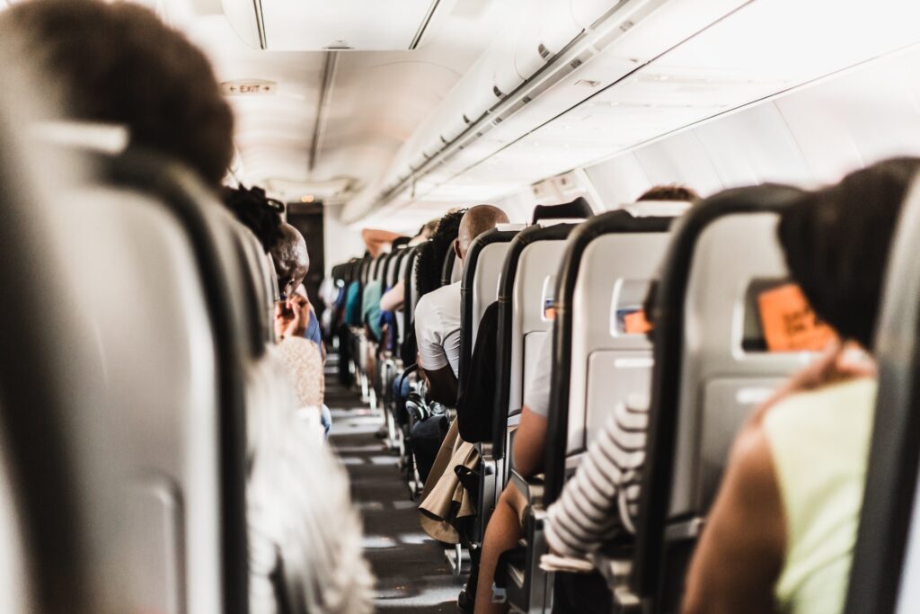 Rows of people in airline seats - how to survive a long haul flight