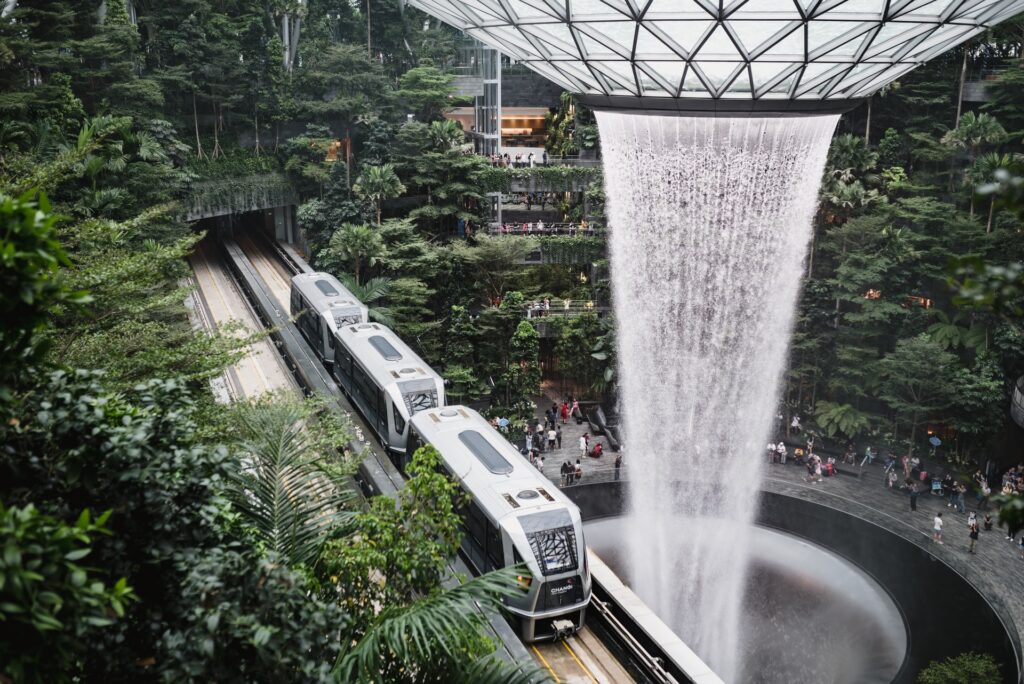 The amazing 'Jewel' terminal at Singapore Changi Airport complete with a beautiful waterfall, plenty of greenery and the passing terminal shuttle train