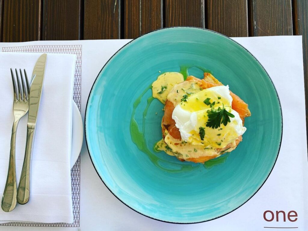 a turquoise plate filed with elegant eggs royale at One, Montenegro