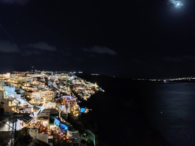 Taking in the night time view with the beautiful lights on the cliffs is a must do when visiting Santorini