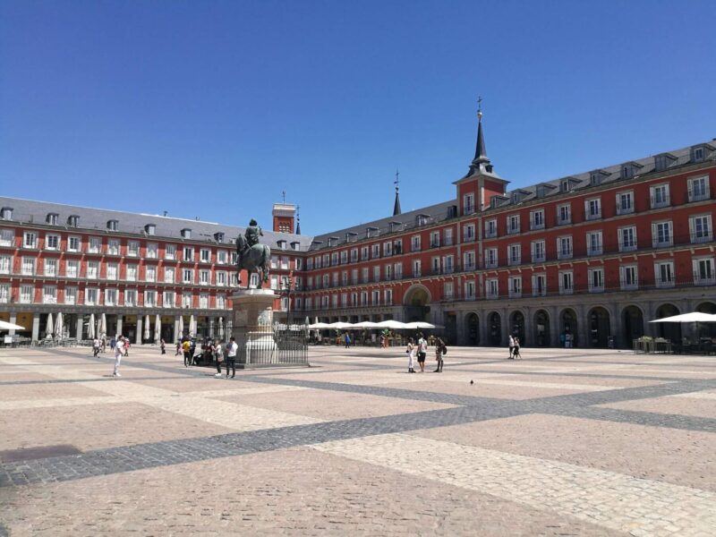 A view over Plaza Mayor in Madrid, Spain on a sunny blue day