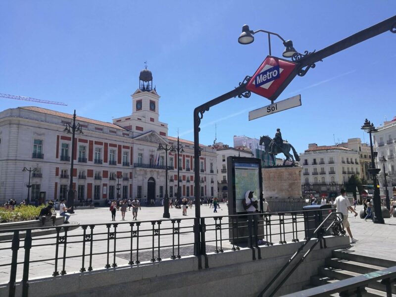Puerta del Sol in Madrid Spain with metro sign in front. One of the most important squares in Madrid and a must do for any Madrid itinerary