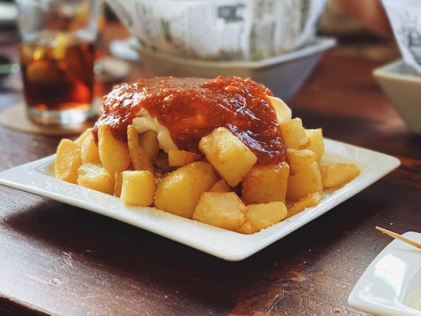 A plate of delicious patatas bravas for tapas in Madrid, Spain