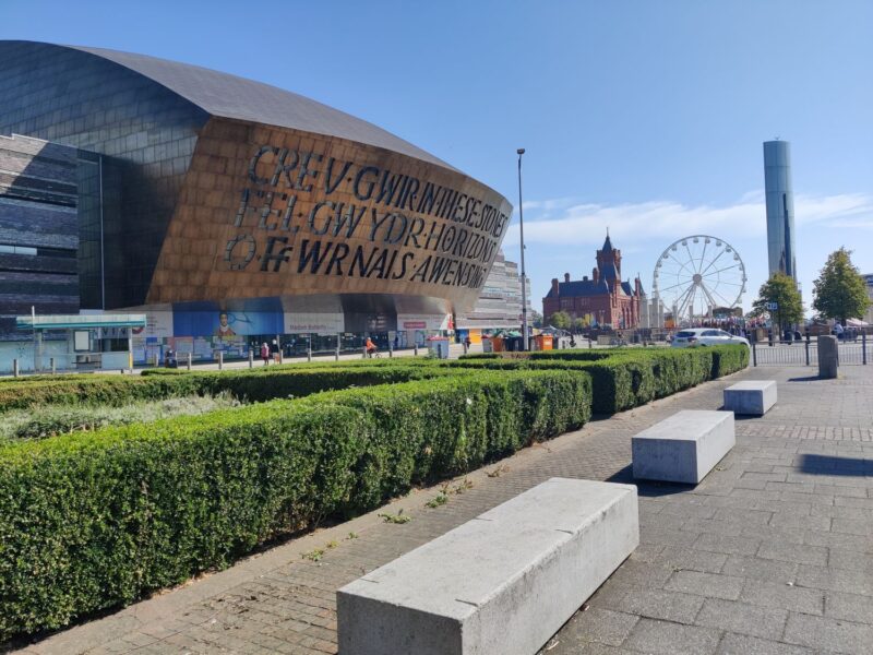 The Millennium Centre in Cardiff Bay with popular Cardiff Bay attractions in the background