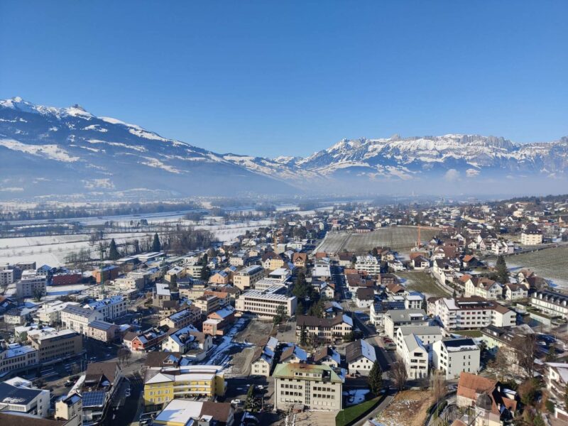 A view over Vaduz, Liechtenstein, on a snowy day. Get from Zurich to Liechtenstein in 1 hour 30 mins