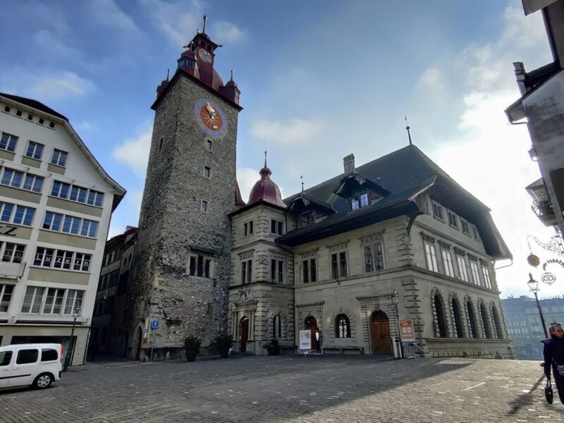 This historical building is the Lucerne Town Hall which features an ornate clock tower