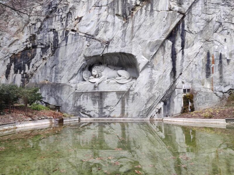 The Lion Monument in Lucerne, Switzerland. A Lion sculpture which is carved into a former sandstone quarry