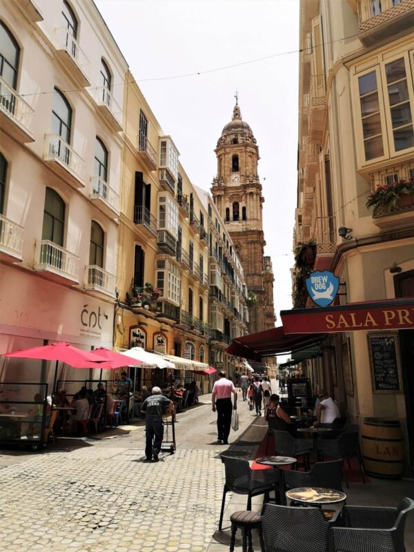 A view down one of the many small streets of Malaga Old Town where the tall Cathedral towers are often in sight